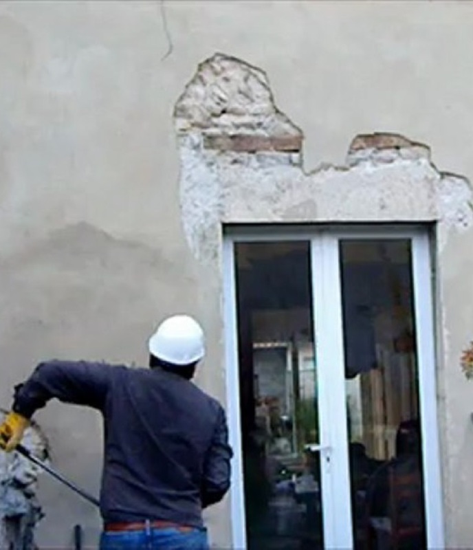 Canne à décrépir les murs